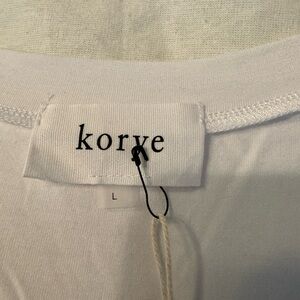 Short sleeve top with knot at the waist! Very cute with tags!